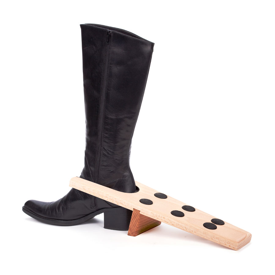 Hardwood boot jack Hardwood boot jack with a black leather boot